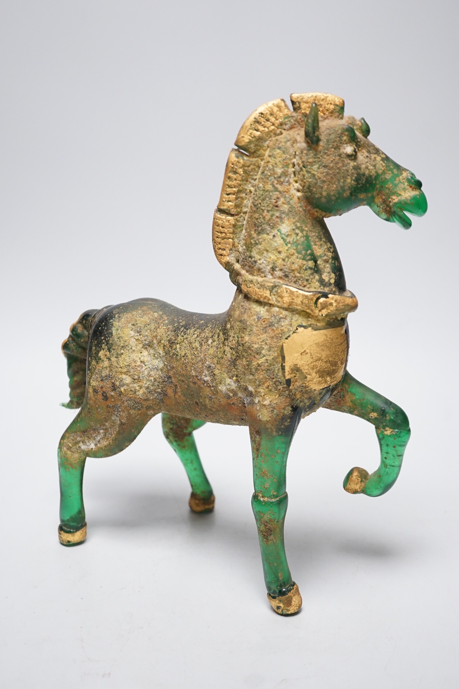 A Murano gilded glass model of the Lion of Venice, 21 cm long and a gilded green glass figure of a horse, 31cm